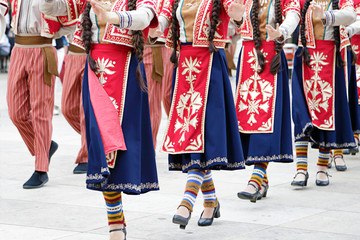 dancers dancing and wearing one of the traditional folk costume from armenia.