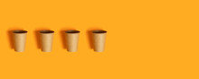 Pattern With Paper Cups On Orange Background With Copy Space