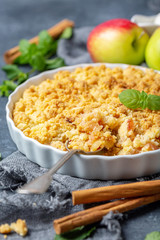 Wall Mural - Apple crumble and a dessert spoon closeup.