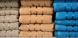 Stacks of terry cotton towels on shelves closeup