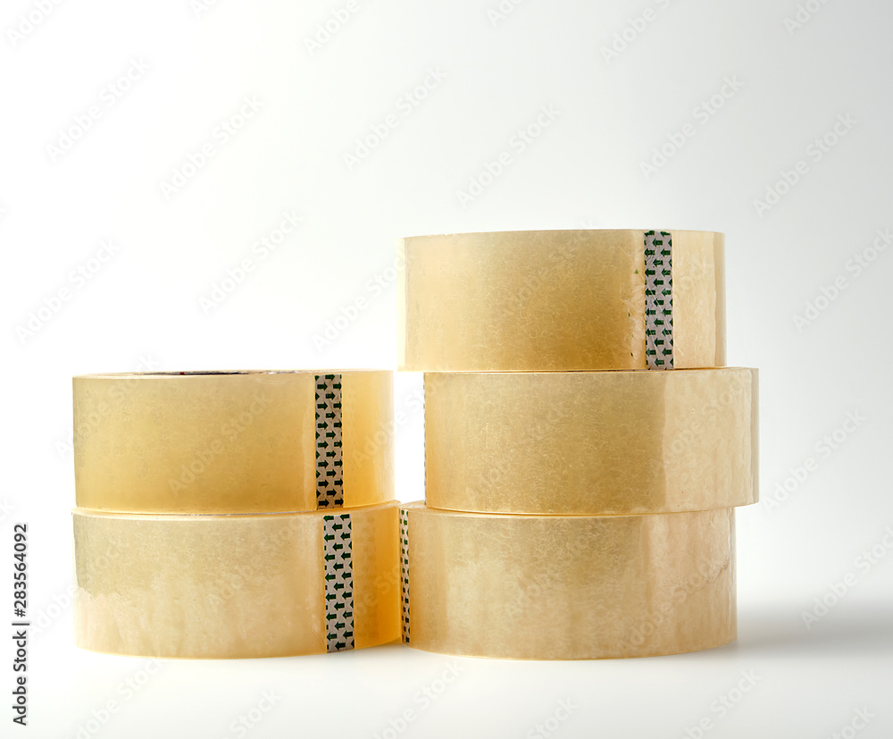 stack of transparent adhesive tape on a white background, close up ...