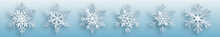 Christmas Set Of White Complex Paper Snowflakes With Soft Shadows On Light Blue Background