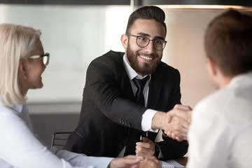 Poster - Close up business partners shaking hand, making agreement at meeting