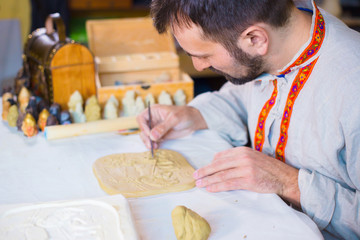 Wall Mural - Potter making clay stamp picture