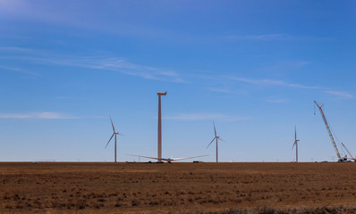 Wind farm construction building of new windmill on the wind power station installed