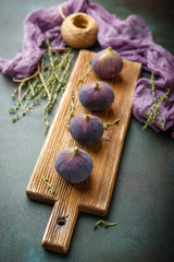 Sticker - Juicy fig fruits on a dark background