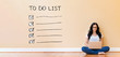 © Tierney - To do list with young woman using a laptop computer