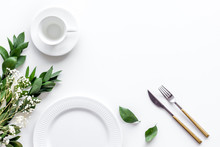 Table Setting With Plates, Flatware And Flower On White Background Top View Copy Space