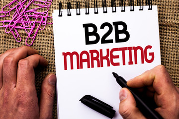 Text sign showing B2B Marketing. Conceptual photo Business to Business Commercial Transactions Commerce written by Man Holding Marker Notebook Book the jute background Pins next to it