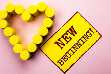 Handwriting Text Writing New Beginning Motivational Call. Concept Meaning Fresh Start Changing Form Growth Life Written Yellow Sticky Note Paper Plain Background With Heart Next To It.
