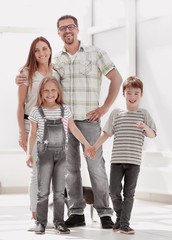 Wall Mural - family with two children standing in a new house