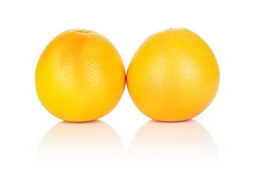 Group of two whole fresh pink grapefruit isolated on white background