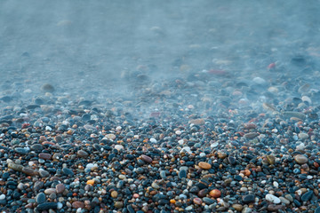 Pebble beach in Kolymbari, Crete, Greece. Natural background.