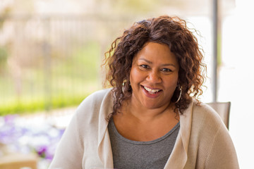 Wall Mural - Beautiful mature African American woman smiling and laughing.