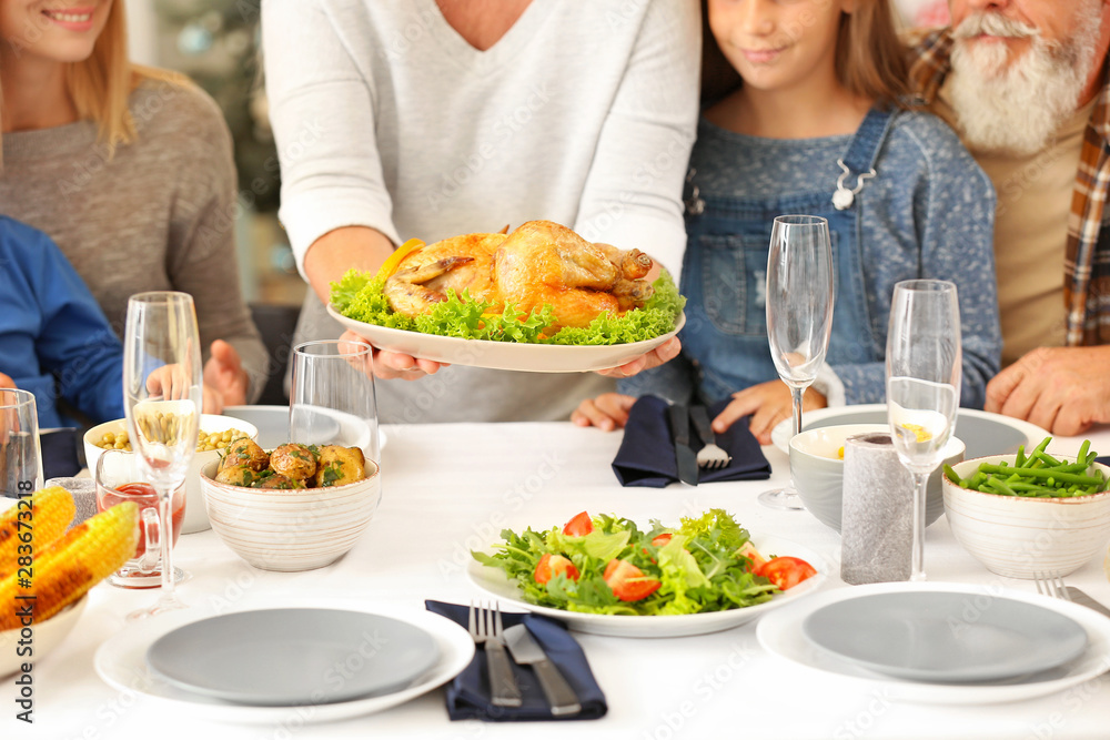 Happy family having Christmas dinner at home