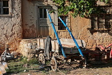 A Horse Carriage In Front Of A Ruined House