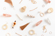 © rorygezfresh - Pattern made of earrings, rings, hairpins on white background