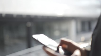 Young man using apps on a touchscreen smartphone - Concept for using technology, shopping online, using mobile apps, texting, phone addiction.