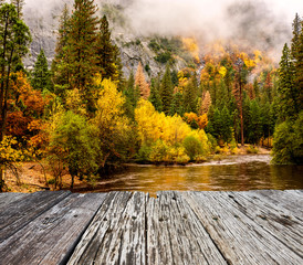 Wall Mural - Yosemite National Park Valley and Merced River at autumn. Low clouds lay in the valley. California, USA.