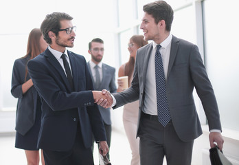 friendly handshake of business people in the office