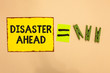 © A - Word writing text Disaster Ahead. Business concept for Contingency Planning Forecasting a disaster or incident Yellow piece paper reminder equal sign several clothespins sending message