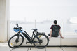 Sideways e-bike with cyclist sitting in background