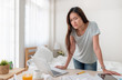 © weedezign - Asian woman freelancer upset with work problem with laptop on mess table.work at home concept.stress working