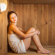 © lightpoet - Young woman relaxing in a sauna
