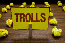 Writing Note Showing Trolls. Business Photo Showcasing Internet Slang Troll Person Who Starts Upsets People On Internet Clothespin Holding Yellow Paper Note Crumpled Papers Several Tries