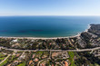 Aerial of ocean view mansions, homes and estates along Pacific Coast Highway in scenic Malibu, California.