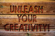 Handwriting text Unleash Your Creativity Call. Concept meaning Develop Personal Intelligence Wittiness Wisdom Wooden background vintage wood board wild message ideas intentions thoughts