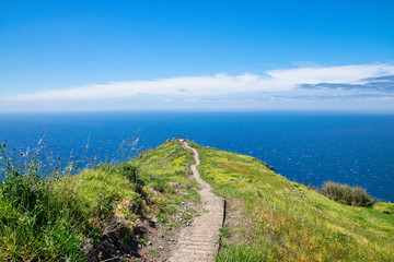 The viewpoint near the Chapel of Nossa Senhora da Boa Morte near Atlantic ocean in summer with blue skyline in Madeira, Portugal 