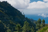 Fototapeta Londyn - Panoramic mountains view from Eira do Serrado viewpoint down to The Atlantic ocean and Funchal city. Madeira Island in summer