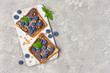 Sandwiches with chocolate spread, pine nuts and blueberries