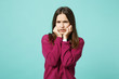 © ViDi Studio - Young fun sad upset perplexed disturb brunette woman girl in red casual clothes posing isolated on blue wall background studio portrait. People sincere emotions lifestyle concept. Mock up copy space.