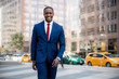 © elnariz - Proud, confident, accomplished, successful, cheerful African American businessman walking confidently to office in downtown financial district