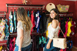 © AntonioDiaz - Female Customers Browsing In Swimwear Store