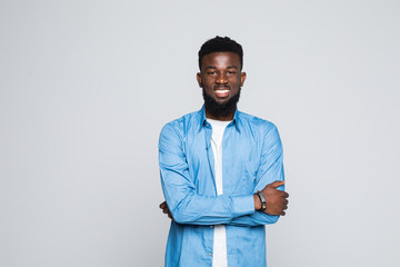 African man posing with crossed arms isolated on white background