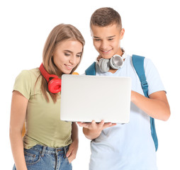 Wall Mural - Portrait of young students with laptop on white background