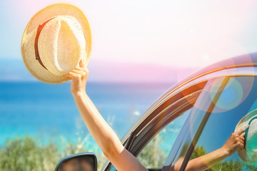 Wall Mural - happy girl from car at sea greece background