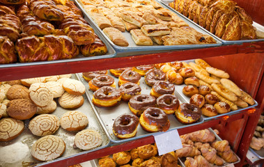 Street bakery selling fresh pastry on a colorful Puebla streets in Zocalo historic city center