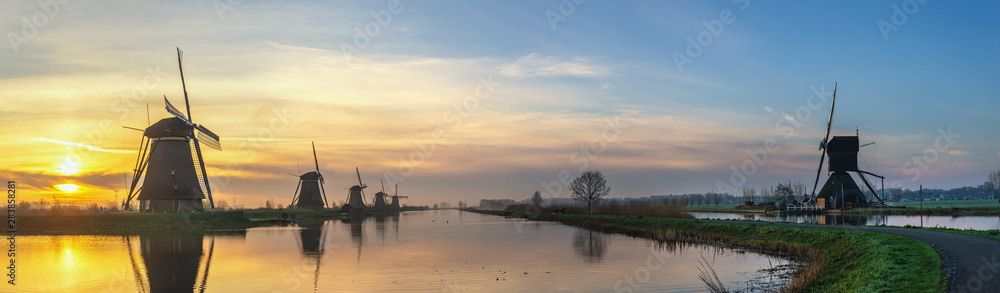 Rotterdam Netherlands, sunrise panorama landscape of Dutch Windmill at Kinderdijk Village - obrazy, fototapety, plakaty 