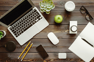 Poster - Office desk with laptop computer, supplies and green apple, top view