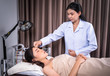 © geargodz - woman undergoing acupuncture treatment on face with doctor