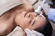 © geargodz - woman receiving ultrasound facial beauty treatment skin care
