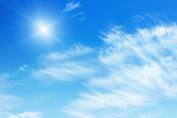 Blue sky with clouds background. Beautiful white fluffy clouds on a light blue sky background. Clearing day and Good weather in the morning.