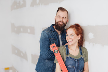 Young couple admiring their DIY renovation work