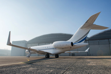 Business jet plane on the ground.