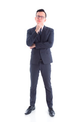 Wall Mural - Full length of handsome asian businessman wearing suit standing and thinking isolated over white background