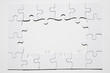 © Freepik - Frame made from white puzzle piece on white background
